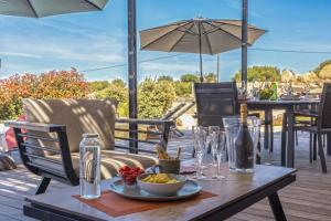 a table with a plate of food on a patio at Villa Davia in Corbara