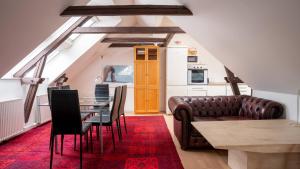 a living room with a couch and a table at Palads Hotel in Viborg