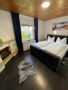 En eller flere senge i et værelse på HarzRoots mit Garage + 14 billeder