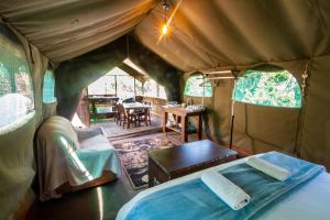 Ένα ή περισσότερα κρεβάτια σε δωμάτιο στο Wilderness Glamping Tents