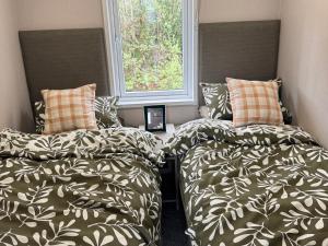 Ένα ή περισσότερα κρεβάτια σε δωμάτιο στο Lime Tree Lodge