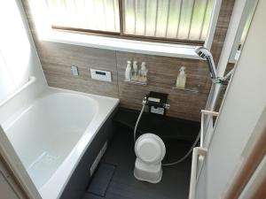 Koupelna v ubytování ゲストハウス寄泊 ー女性のための 香取のお家ー Guesthouse Yohaku + 7 fotografií