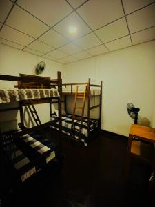 a room with two bunk beds in a room at Villa Turtle in Galle