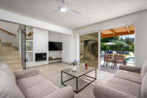 TV a/nebo společenská místnost v ubytování Villa Costazia