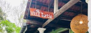 a sign on a building that says vida unique at Villa Turtle in Galle +36 photos