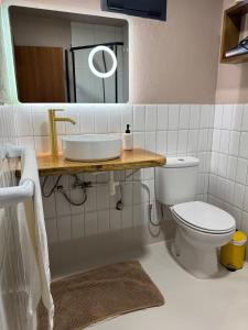 a bathroom with a sink and a toilet at Victoria Ocean View Room in Ponta do Pargo +35 photos
