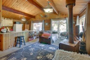 a kitchen and a living room with a stove at Walk to Lava Hot Springs Pools from Cozy Cabin! in Lava Hot Springs