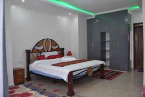 Voodi või voodid majutusasutuse Tausi mweupe toas