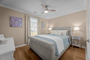 a bedroom with a bed and a ceiling fan at Pet-Friendly 3 BR Home with King Bed and Fenced Yard Near Downtown in New Bern