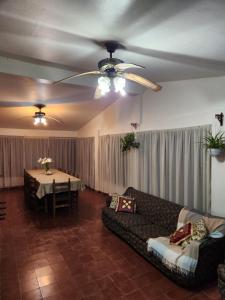 a living room with a couch and a table at Davolio Hosting in Yerba Buena