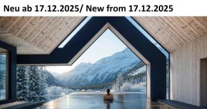 a woman sitting in a pool with a view of a mountain at Forster's Naturresort in Neustift im Stubaital