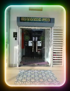 an entrance to a kxka barcelonakritkritkritkritkritkrit suite at KM Barakah Suite in Kuala Terengganu