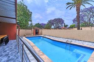 a swimming pool in the backyard of a house at 45 on westmoreland in Johannesburg +14 photos