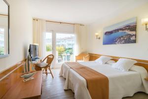 TV a/nebo společenská místnost v ubytování Hotel Ancora