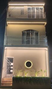 a lit up building with plants in front of it at Studio 101 Cop 30 in Belém