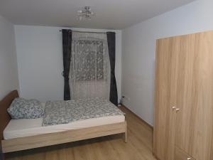 Ένα ή περισσότερα κρεβάτια σε δωμάτιο στο Maxhaus 3