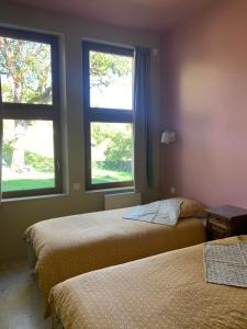 Postel nebo postele na pokoji v ubytování Le Clos des Tilleuls