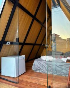 Ένα ή περισσότερα κρεβάτια σε δωμάτιο στο Chalés chácara Santa Felicidade