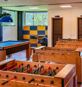 a classroom with pool tables and ping pong balls at Pousada Ilha Vitoria in Ubatuba