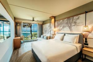 Postel nebo postele na pokoji v ubytování Radisson Blu Poste Lafayette Resort & Spa (Adults Only) + 56 fotografií