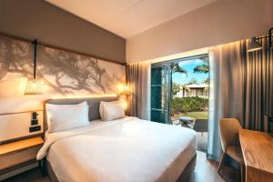 Postel nebo postele na pokoji v ubytování Radisson Blu Poste Lafayette Resort & Spa (Adults Only)