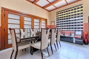 a dining room with a table and chairs at 45 on westmoreland in Johannesburg