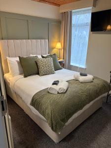 Postel nebo postele na pokoji v ubytování The Boutique Bungalow