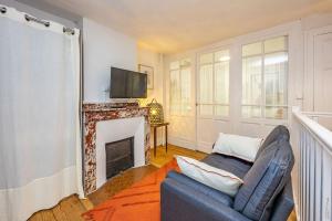 Μια τηλεόραση ή/και κέντρο ψυχαγωγίας στο Le Duplex Gaillacois - Au Cœur de Gaillac