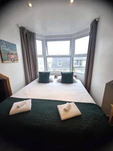 Ένα ή περισσότερα κρεβάτια σε δωμάτιο στο Town Lodge +1 φωτογραφίες