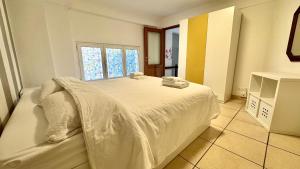 Giường trong phòng chung tại 5 min dal Mare Grazioso Trilocale