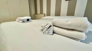 Giường trong phòng chung tại 5 min dal Mare Grazioso Trilocale +24 ảnh