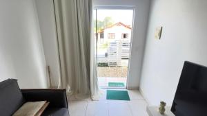 Χώρος καθιστικού στο Casa Ampla com Ar Condicionado 450m praia Rua Canoas