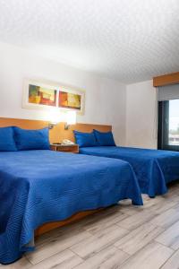 Postel nebo postele na pokoji v ubytování Hotel Galerías Express + 3 fotografie