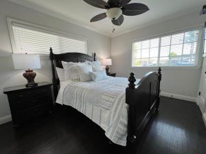 a bedroom with a bed and a ceiling fan at Destination #12 in Anaheim