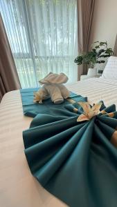 Ένα ή περισσότερα κρεβάτια σε δωμάτιο στο Space Cherngtalay Condo bangtao by sahana