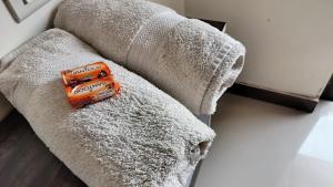 an orange toy truck sitting on a couch at Stay Classy Inn in Mahabaleshwar +10 photos