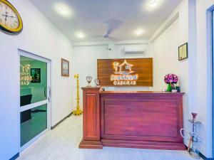 a entrance to a restaurant with a clock on the wall at Downsouth Cabanas in Habaraduwa +74 photos