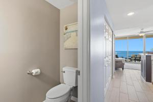 a bathroom with a toilet and a view of the ocean at Beach Club unit 502C- Catalina in Gulf Highlands +24 photos