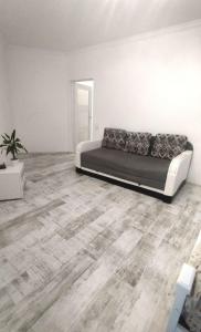 a bedroom with a bed and a wooden floor at Стрийська Арена King Cross Автовокзал Новобуд in Lviv