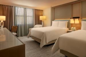 Ένα ή περισσότερα κρεβάτια σε δωμάτιο στο Loews Miami Beach Hotel