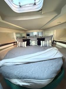 a large bed in the middle of a room at punta excursiones the king of kings in Punta Cana