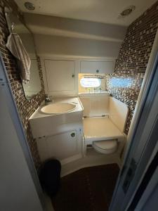 a small bathroom with a sink and a toilet at punta excursiones the king of kings in Punta Cana