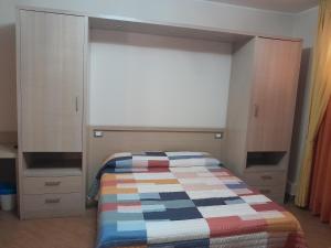 a bedroom with a bed and a large window at Affittacamere Certe Notti in Sala Consilina