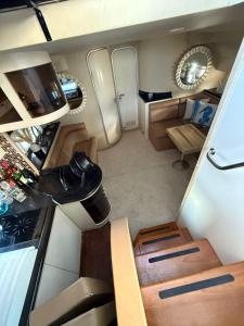 an interior view of an rv with a table and chairs at punta excursiones the king of kings in Punta Cana