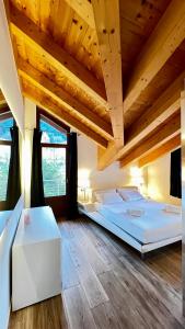Ένα ή περισσότερα κρεβάτια σε δωμάτιο στο Casa Stelvio