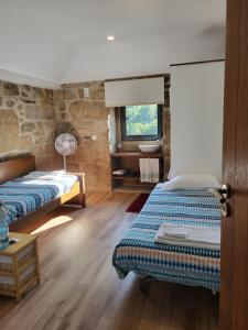 Ένα ή περισσότερα κρεβάτια σε δωμάτιο στο Family home with terrace and salamander