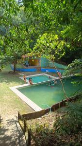 Bazén v ubytování Ecopousada Bacabas - Hotel, Camping e Balneário nebo v jeho okolí
