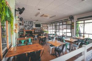 a restaurant with tables and chairs in a room at HolaCamp Sitges Relax in Sitges