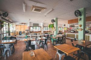 a restaurant with tables and chairs in a room at HolaCamp Sitges Relax in Sitges +37 photos