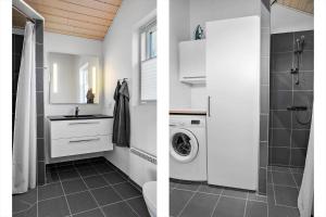 a bathroom with a sink and a washing machine at 30178-Odder-Chr-Christensensvej-9 in Beder +23 photos